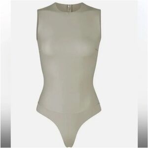 Skims faux leather bodysuit in shell